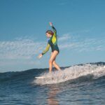 surfing girl on a wave