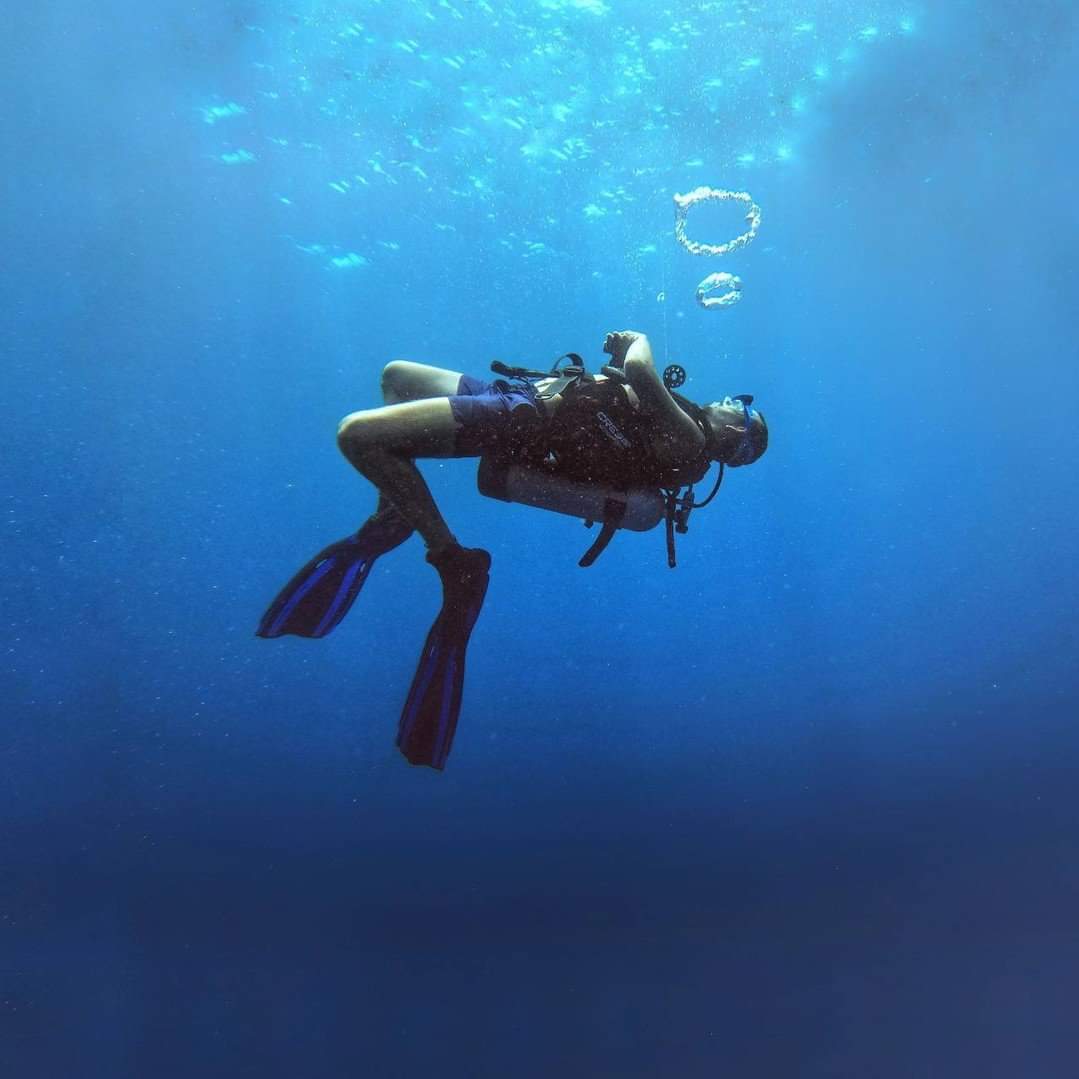 Diver underwater making bubbles