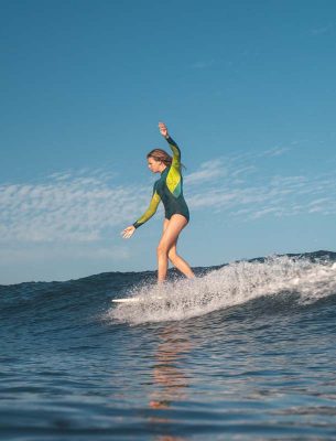 surfing girl on a wave
