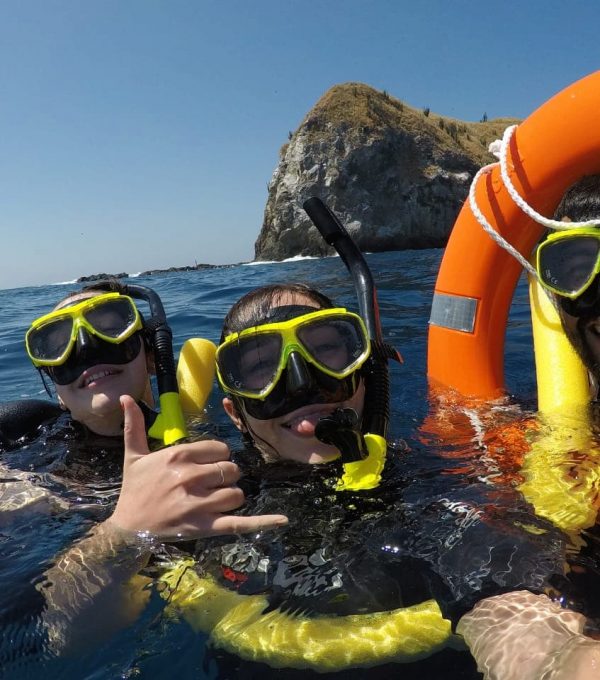 Friends snorkeling in the Pacific Ocean